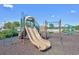 Community playground with slide and climbing structure under a clear blue sky at 1501 Palmina Loop # B, Myrtle Beach, SC 29588