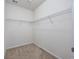 Empty walk-in closet with carpet floors and wire shelving for organizing clothes and accessories at 1501 Palmina Loop # B, Myrtle Beach, SC 29588