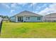 Backyard featuring a grassy yard, patio and a sliding glass door leading into the home at 156 Teddy Bear Circle, Conway, SC 29526