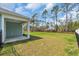 Spacious backyard features a well-manicured lawn and a black metal fence surrounding property at 156 Teddy Bear Circle, Conway, SC 29526