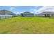 Large backyard has a manicured lawn and a black metal fence surrounding the property at 156 Teddy Bear Circle, Conway, SC 29526