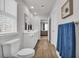 Bathroom features a dual-sink vanity with wood flooring, and a toilet under the window at 156 Teddy Bear Circle, Conway, SC 29526
