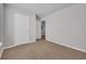 Empty bedroom features neutral carpet, white walls, and a doorway to another room at 156 Teddy Bear Circle, Conway, SC 29526