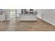 Open floorplan with kitchen island, white cabinetry, and stainless steel appliances at 156 Teddy Bear Circle, Conway, SC 29526