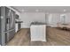 Kitchen island with granite countertops, stainless steel fridge, and modern appliances at 156 Teddy Bear Circle, Conway, SC 29526