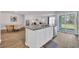 Open-concept kitchen with granite countertops, stainless steel appliances, and an adjacent dining and living area at 156 Teddy Bear Circle, Conway, SC 29526