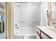 Bright bathroom featuring a shower-tub combo and essential amenities at 1604 N Ocean Blvd. # 903, Myrtle Beach, SC 29577
