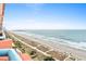 Expansive view of the beach from a condo balcony, showcasing the ocean and sandy shoreline at 1604 N Ocean Blvd. # 903, Myrtle Beach, SC 29577