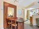 Cozy dining area adjacent to the kitchen, features a murphy bed for flexible space at 1604 N Ocean Blvd. # 903, Myrtle Beach, SC 29577