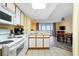 Open-concept kitchen featuring laminate floors, and appliances at 1604 N Ocean Blvd. # 903, Myrtle Beach, SC 29577