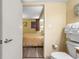 Bathroom adjacent to a bedroom, featuring a toilet, vanity and rolled up towels at 1604 N Ocean Blvd. # 904, Myrtle Beach, SC 29577