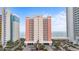 Exterior of the condo building with ocean views, featuring multiple balconies and well-maintained landscaping at 1604 N Ocean Blvd. # 904, Myrtle Beach, SC 29577
