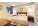 Cozy bedroom featuring a bed, soft lighting, and a connected bathroom at 1604 N Ocean Blvd. # 904, Myrtle Beach, SC 29577