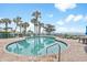 Relaxing circular pool featuring clear blue water and surrounding palm trees for a tropical feel at 1604 N Ocean Blvd. # 904, Myrtle Beach, SC 29577