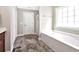 Bathroom featuring a white bathtub, a window and a door to the outside at 1794 Graham Rd., Aynor, SC 29544