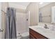 Bathroom showcasing a shower with a curtain, a mirrored vanity, and modern fixtures at 1794 Graham Rd., Aynor, SC 29544