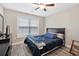 This cozy bedroom boasts a ceiling fan and a window for natural lighting at 1794 Graham Rd., Aynor, SC 29544