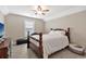 Cozy bedroom featuring a decorative wooden bedframe, paired with a ceiling fan at 1794 Graham Rd., Aynor, SC 29544