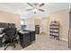 This bonus room features a ceiling fan, a bookshelf, and ample space for storage at 1794 Graham Rd., Aynor, SC 29544