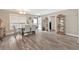 Bright dining area with light-colored walls, wood-look flooring, and modern furnishings and decor at 1794 Graham Rd., Aynor, SC 29544