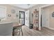 Bright dining area featuring wood-look flooring, neutral walls, and a stylish wooden table and chairs at 1794 Graham Rd., Aynor, SC 29544