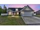 Beautiful home with well-maintained lawn, large driveway, and traditional architecture at 1794 Graham Rd., Aynor, SC 29544
