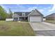 Charming single-Gathering home with a well-manicured lawn and attached two-car garage at 1794 Graham Rd., Aynor, SC 29544