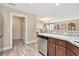 View of the Kitchen featuring granite countertops and stainless steel dishwasher with a view to the doorway and living room at 1794 Graham Rd., Aynor, SC 29544