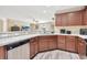 Well-equipped kitchen featuring stainless steel appliances, granite countertops, and dark wood cabinetry at 1794 Graham Rd., Aynor, SC 29544
