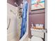 Cozy bathroom featuring a shower with modern fixtures and decorative coastal-themed accents at 1801 N Ocean Blvd. # O-4, North Myrtle Beach, SC 29582