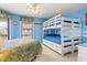 Bright bedroom with a bunk bed, full bed, ceiling fan and natural light, perfect for Gathering or guests at 1801 N Ocean Blvd. # O-4, North Myrtle Beach, SC 29582