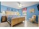 Coastal bedroom featuring a queen bed, ceiling fan, and nautical decor at 1801 N Ocean Blvd. # O-4, North Myrtle Beach, SC 29582