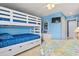 Well-lit bedroom with a bunk bed, dresser, and coastal decor, perfect for relaxation and comfort at 1801 N Ocean Blvd. # O-4, North Myrtle Beach, SC 29582