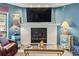 Cozy living room featuring fireplace, TV, and decorative side tables at 1801 N Ocean Blvd. # O-4, North Myrtle Beach, SC 29582