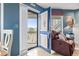 An open door leads from the living room to a balcony with a peaceful view at 1801 N Ocean Blvd. # O-4, North Myrtle Beach, SC 29582
