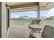 Charming covered porch with seating, offering neighborhood views and outdoor relaxation at 1801 N Ocean Blvd. # O-4, North Myrtle Beach, SC 29582