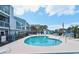 Inviting community pool surrounded by ample seating, palm trees, and well-maintained condos at 1891 Colony Dr. # 15E, Surfside Beach, SC 29575