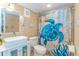 Stylish bathroom featuring a modern vessel sink and sea turtle-themed decor at 200 76Th Ave. N # 1211, Myrtle Beach, SC 29572