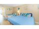 Comfortable bedroom with two beds, dresser, and ocean-themed decorations at 200 76Th Ave. N # 1211, Myrtle Beach, SC 29572