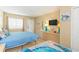 Comfortable bedroom with two beds, dresser, and beach-themed decorations at 200 76Th Ave. N # 1211, Myrtle Beach, SC 29572