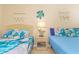 Inviting bedroom with two beds and beach decor, creating a relaxing coastal vibe at 200 76Th Ave. N # 1211, Myrtle Beach, SC 29572