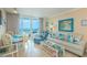 Relax in this sun-filled living room with stylish furniture and an ocean view at 200 76Th Ave. N # 1211, Myrtle Beach, SC 29572