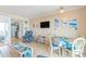 Cozy living area with TV and dining space, offering ocean view access at 200 76Th Ave. N # 1211, Myrtle Beach, SC 29572