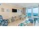 Cozy living room with ocean view, comfortable seating, and coastal decor at 200 76Th Ave. N # 1211, Myrtle Beach, SC 29572