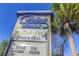 Close-up of Carolina Winds signage and The Beach Pit Bar & Grill on a sunny day at 200 76Th Ave. N # 1211, Myrtle Beach, SC 29572