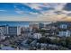 An aerial view of a city by the ocean with buildings, trees and houses at 201 74Th Ave. N # 1128, Myrtle Beach, SC 29572