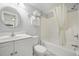 Bright bathroom featuring a shower-tub combo, white vanity, and towel rack with fresh towels at 201 74Th Ave. N # 1128, Myrtle Beach, SC 29572