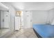 Cozy bedroom features one bed, white dresser, and view of balcony through open door at 201 74Th Ave. N # 1128, Myrtle Beach, SC 29572