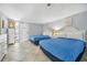 Comfortable bedroom with two beds, dresser, nautical decor and sliding glass door to the outside at 201 74Th Ave. N # 1128, Myrtle Beach, SC 29572