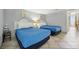 Bright bedroom features two beds with white headboards and nautical themed decorations at 201 74Th Ave. N # 1128, Myrtle Beach, SC 29572